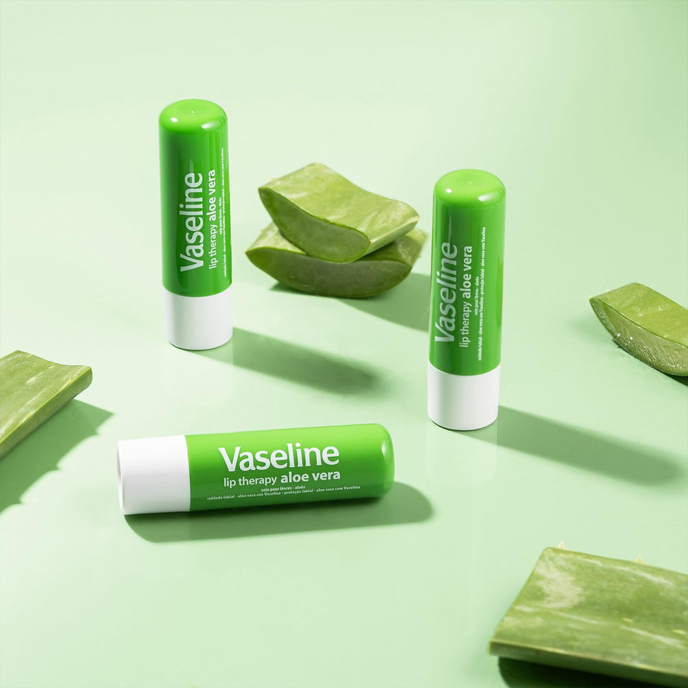 Vaseline Lip Therapy application shot showing smooth glide on lips.