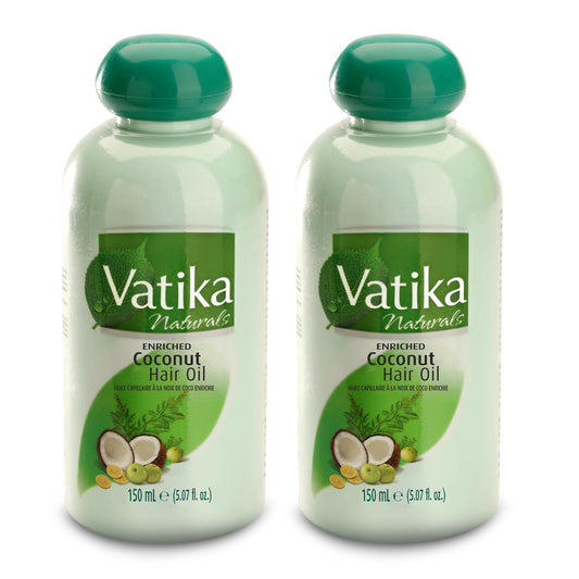 Vatika Dabur coconut oil bottle pour for easy application and nourishment.