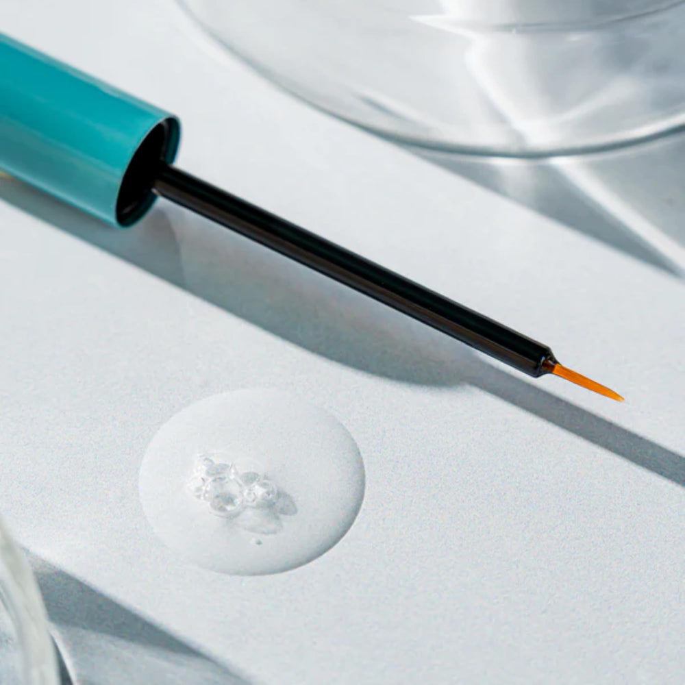Vellora Lash Growth Serum texture close-up showing smooth, non-sticky formula.
