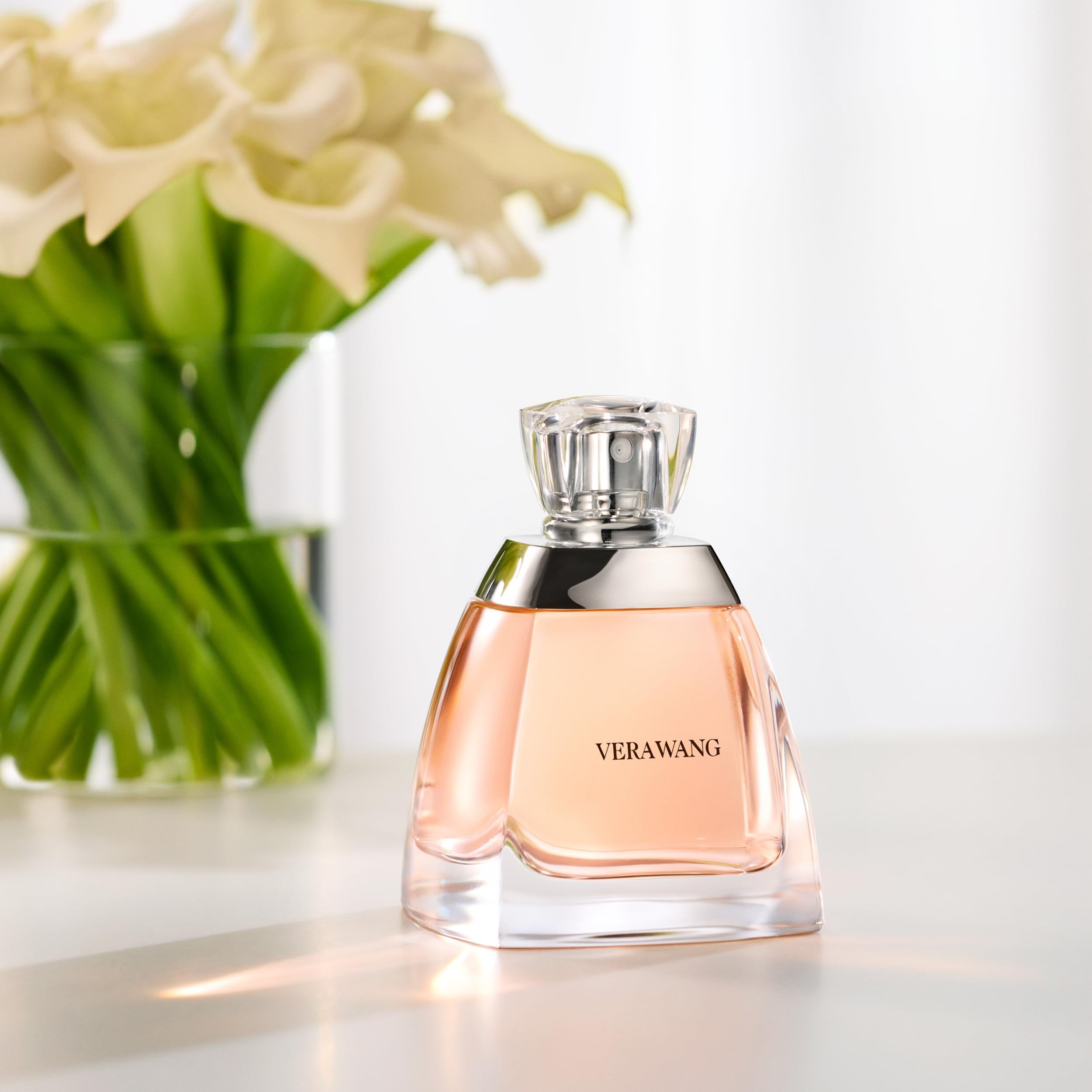Vera Wang EDP on a dresser with soft lighting for timeless elegance