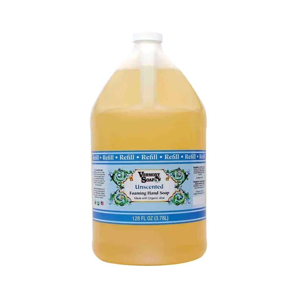 VERMONT SOAP Organics foaming hand soap dispensing in a clean bathroom.