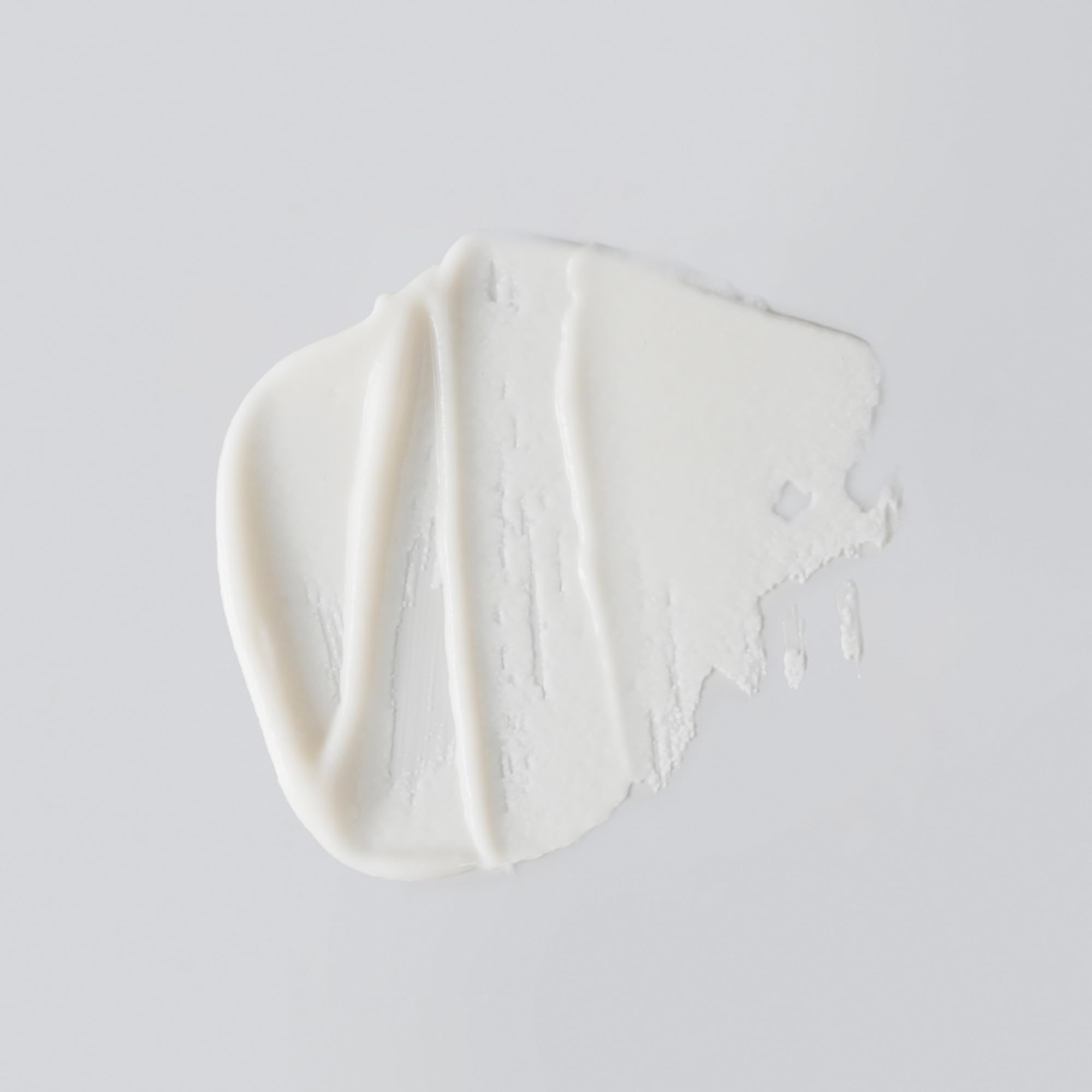 Versed creamy texture swatch highlights gentle, daily exfoliation.