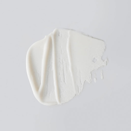 Versed creamy texture swatch highlights gentle, daily exfoliation.