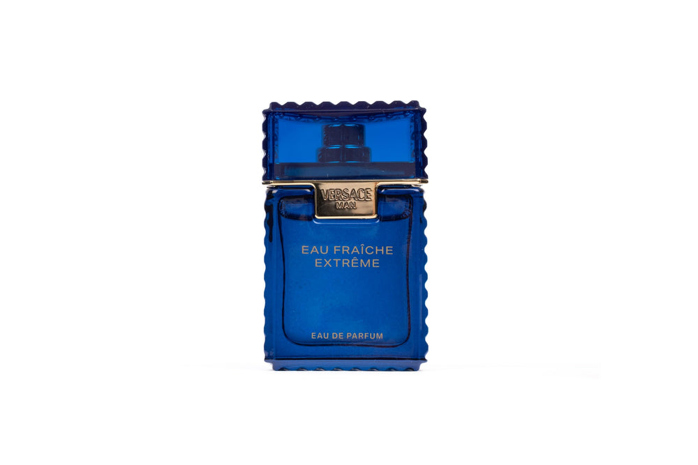 Versace Eau Fraiche Extreme mini bottle cap close-up showing premium design.