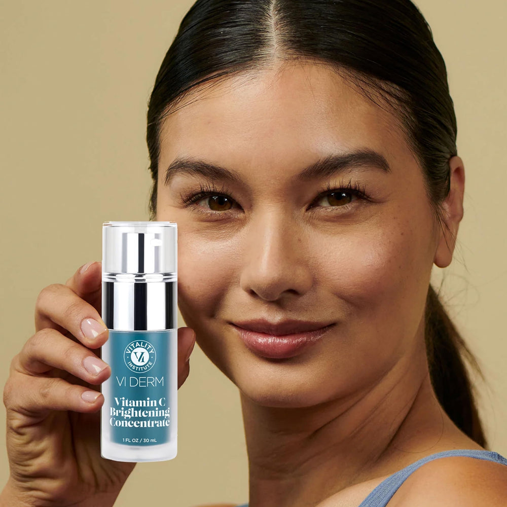 VI Derm Vitamin C Brightening Concentrate on skin shows hydration and glow.
