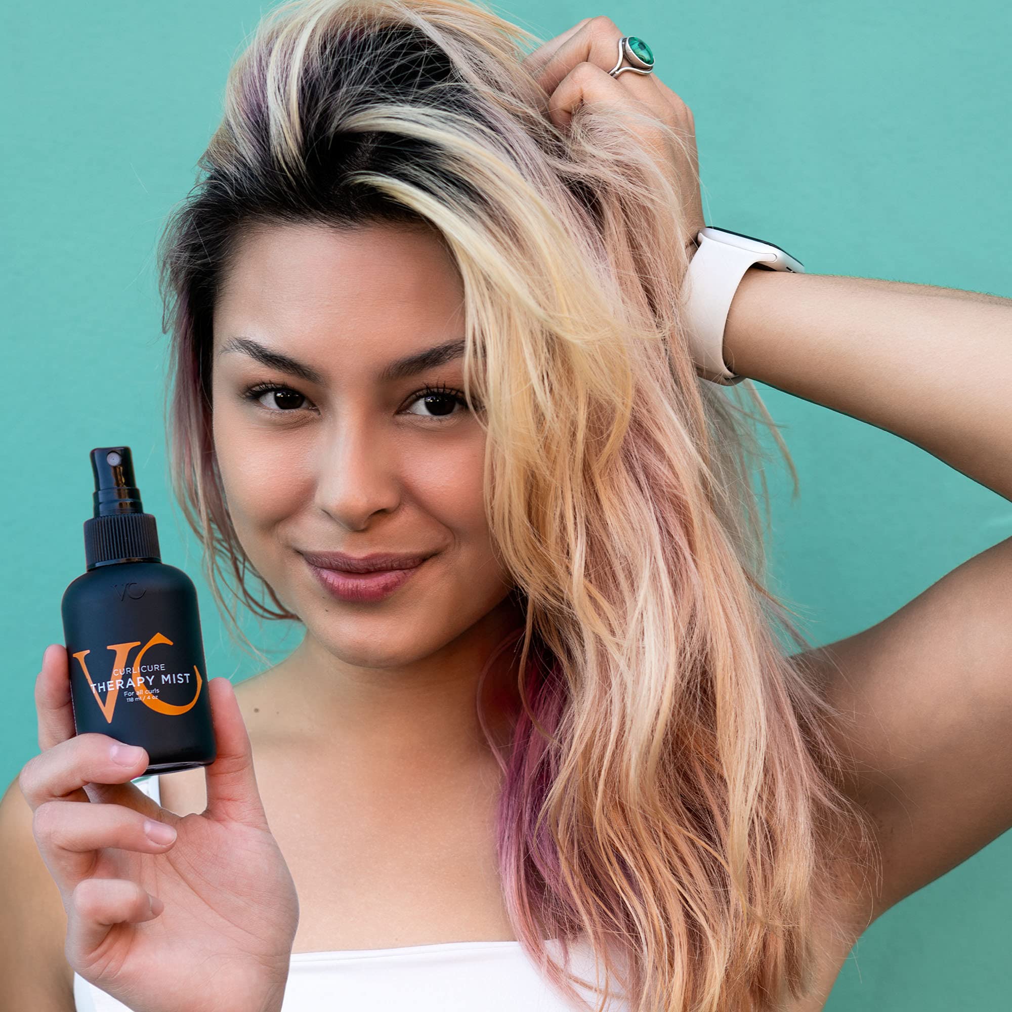 VICIOUS CURL Curlicure Therapy Mist applied to damp hair before styling for moisture