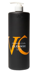 VICIOUS CURL Foaming Cleanse foam on hair showing moisture-rich lather for defined curls.