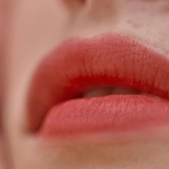 Victoria Beckham Beauty lip tint bitten-effect swatch on arm for shade reference.