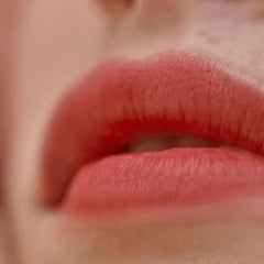 Victoria Beckham Beauty lip tint bitten-effect swatch on arm for shade reference.