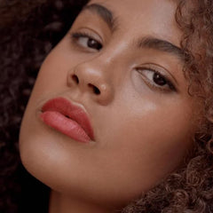 Victoria Beckham Beauty lip tint bitten-effect close-up outlines cupid's bow for precise application.