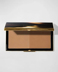 Victoria Beckham Bronzing Brick packaging, travel-friendly compact for on-the-go glow.