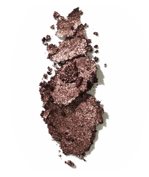 Victoria Beckham Beauty Shimmery Lid Lustre applied to eyelid for subtle glow.