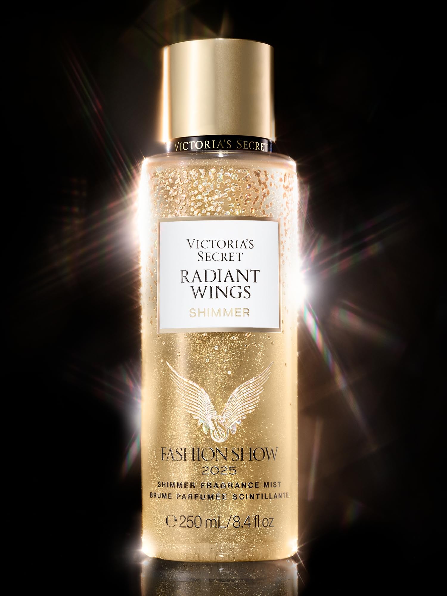Victoria's Secret Radiant Wings bottle with glitter accents evokes runway glamour.
