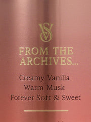 Hands applying Victoria's Secret Vanilla Lace mist for a soft, warm aroma.