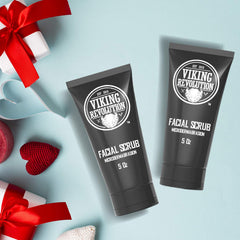 Applying Viking Revolution face scrub to skin for smoother prep before shaving.