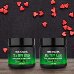 Tea Tree Oil Cream tube with label close-up highlighting natural ingredients.