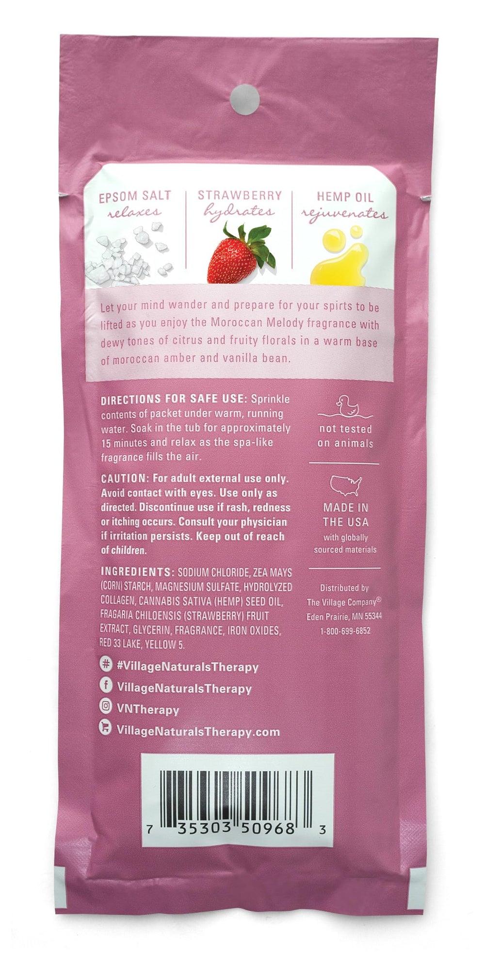 Village Naturals Therapy Glow bottle close-up highlights citrus-rose scent and nourishing minerals.
