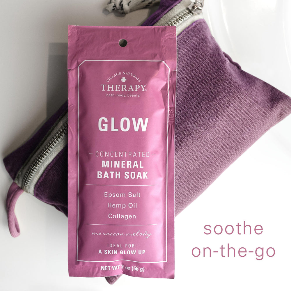Village Naturals Therapy Glow bath-soak on tub evokes Moroccan-inspired serenity and calm.