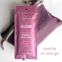 Village Naturals Therapy Glow bath-soak on tub evokes Moroccan-inspired serenity and calm.