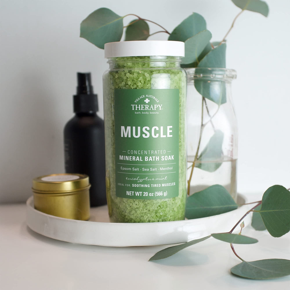 Village Naturals Therapy Muscle Bath Soak packaging on shelf.