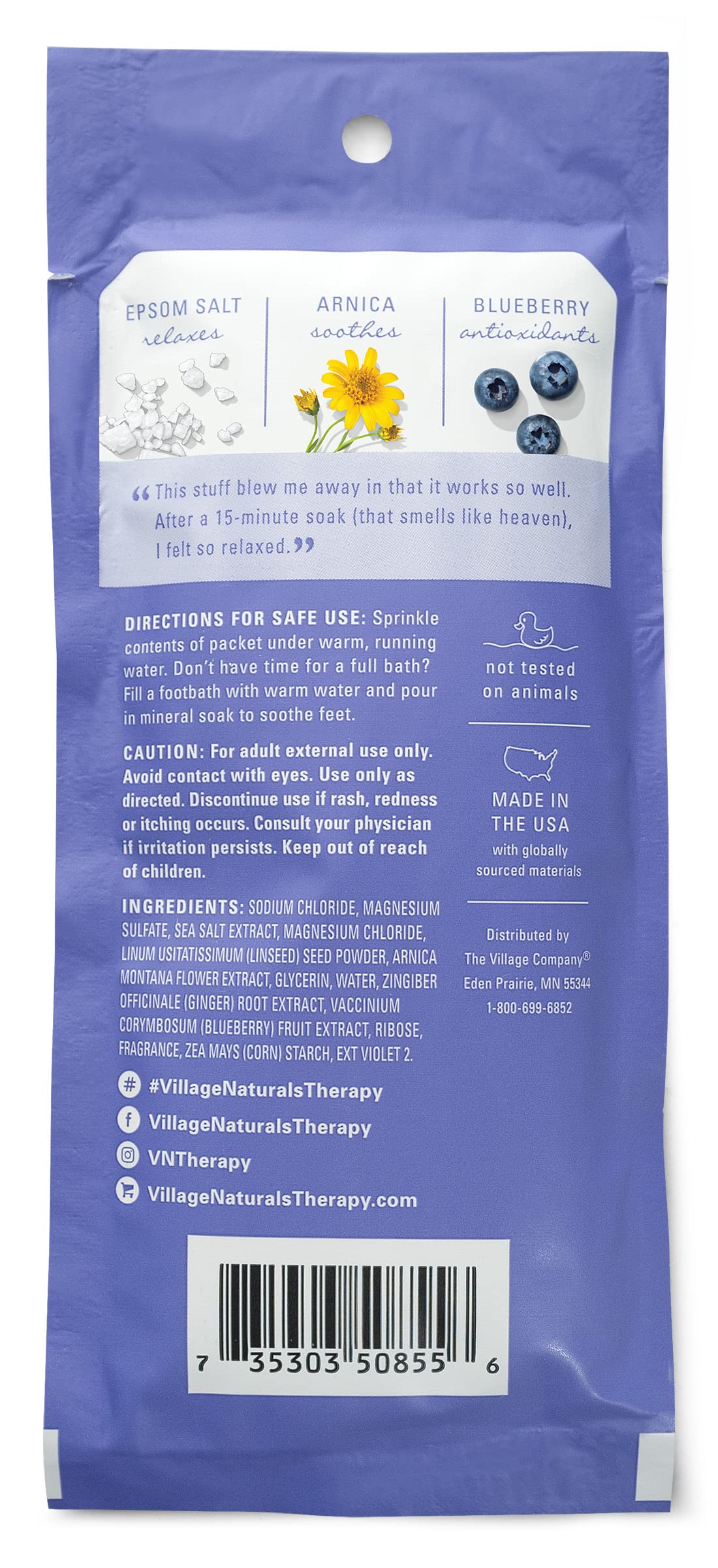 Village Naturals Therapy soak packet dissolving in warm water for relaxation.