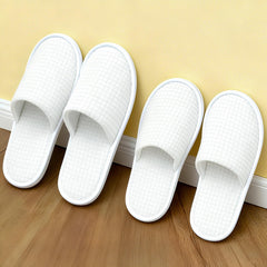 Vipay white M size disposable slippers in sealed packaging for hotels