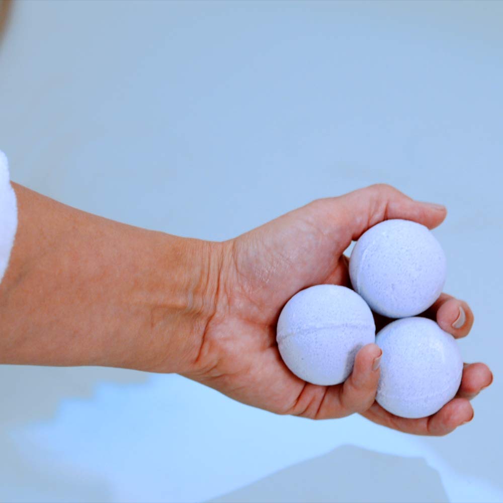 Vitabath Bath Fizzies Lavender Chamomile fizzing action in tub.