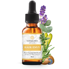 Vitality Hair Envy bottle closeup shows premium oil blend for healthier hair