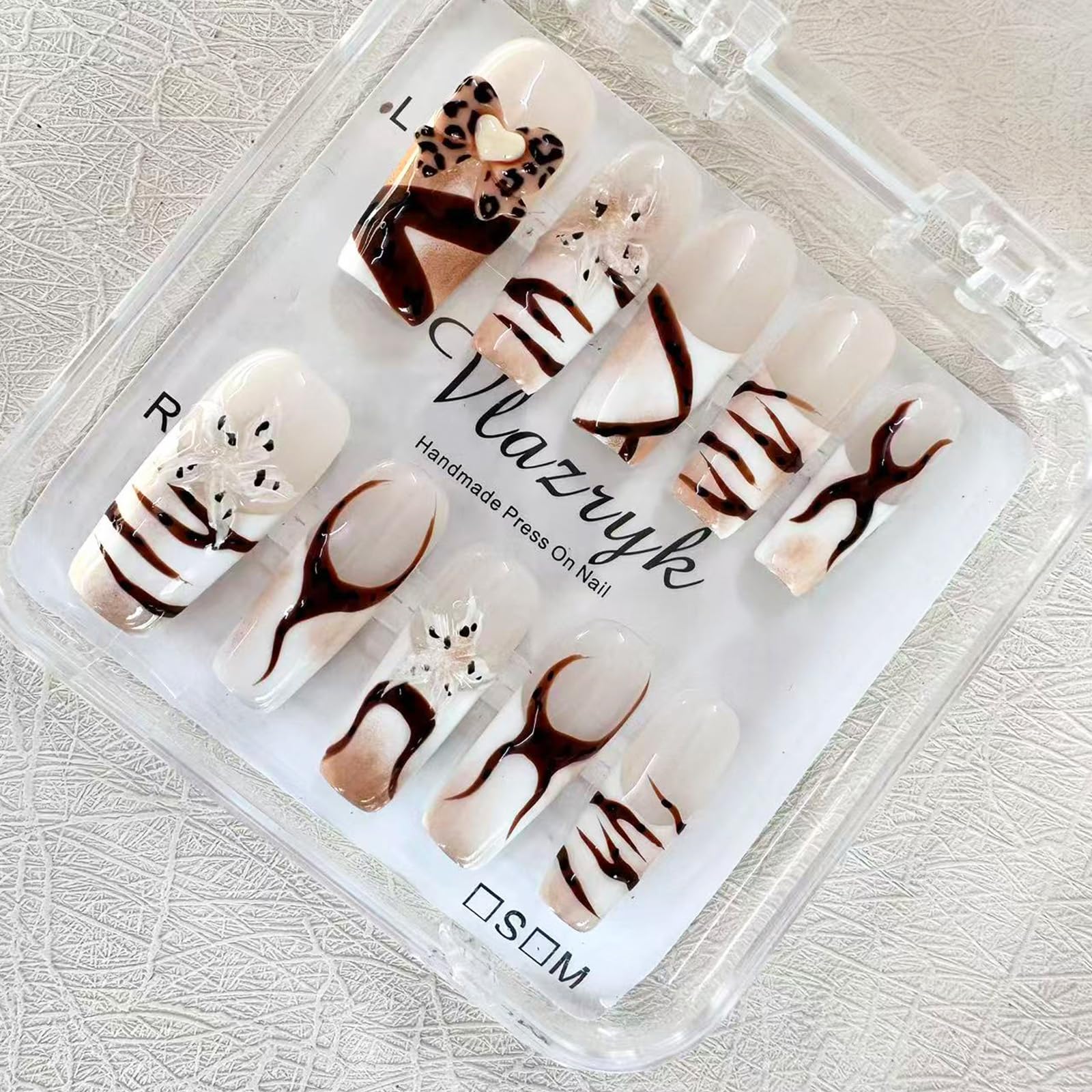 Vlazryk nails with stars and leopard 3D embossed nails for an easy at-home glamorous look.