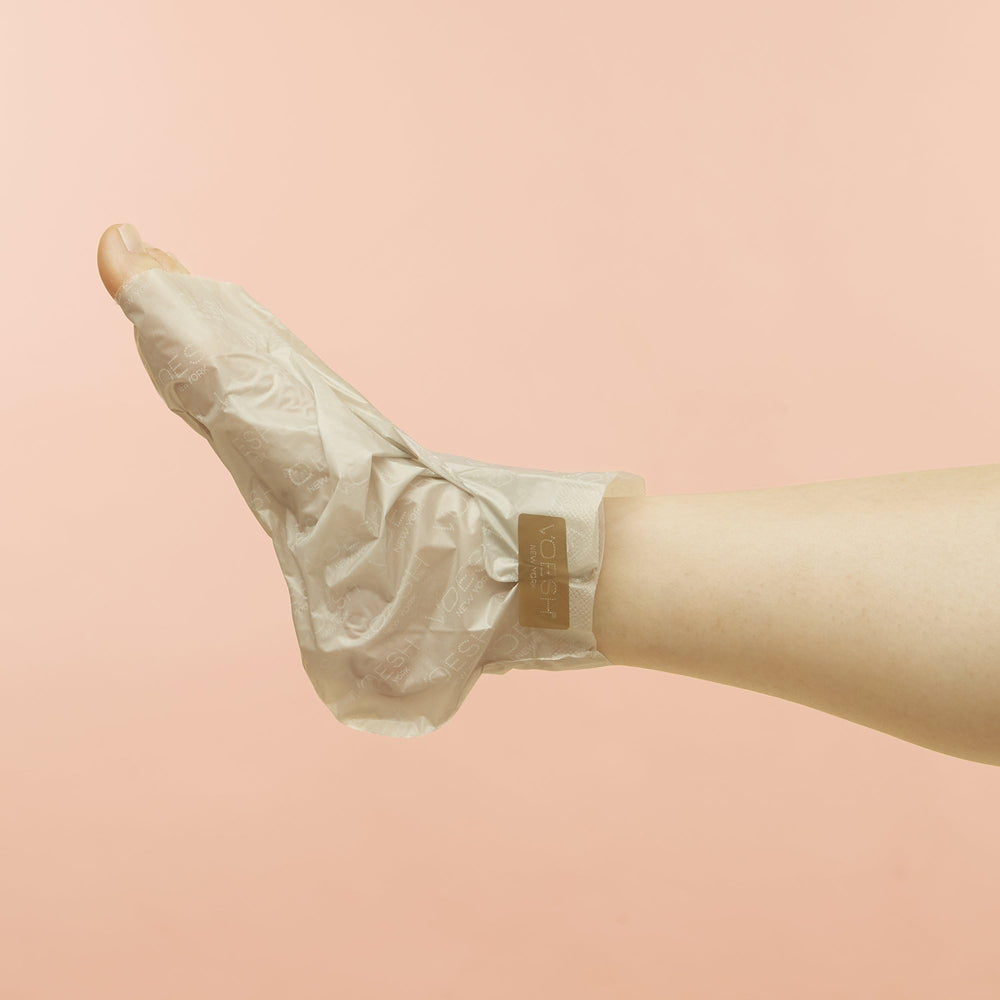 VOESH Collagen Socks on clean feet ready for spa-like care.