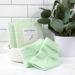 Person wearing VOESH Moisturizing Heel Socks on feet.