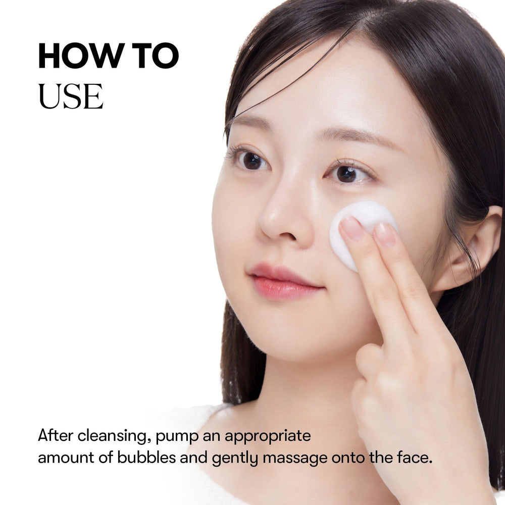 Person applying VT COSMETICS Bubble Serum to the face.