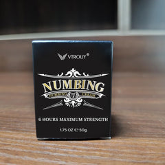 VTROUY Numbing Cream bottle closeup with arnica and emu oil for skin hydration.
