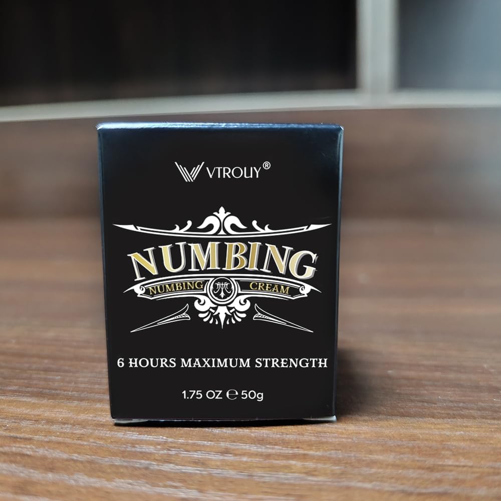 Close-up of VTROUY Numbing Cream bottle showing long-lasting, quick-absorb formula.