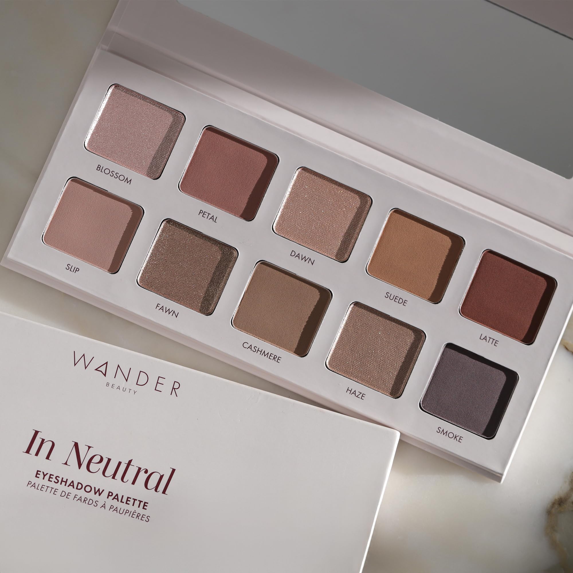 Wander Beauty In Neutral travel case view emphasizing portability.