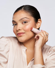 Wander Beauty On-the-Glow body-glow on skin for seamless highlight.