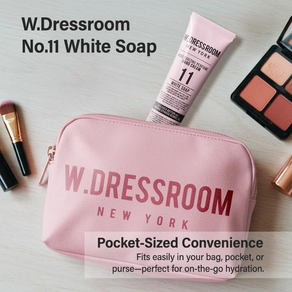 W.Dressroom Hand Cream on desk with bag, ideal for all-day carry.