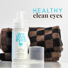 We Love Eyes Tea Tree Cleanser pump bottle in use with a light foaming rinse.