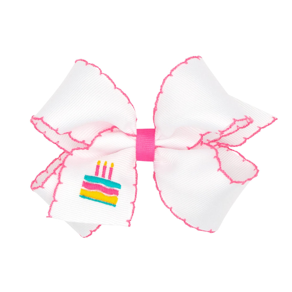 Wee Ones grosgrain bow with Moonstitch cake stitch for birthday celebrations.