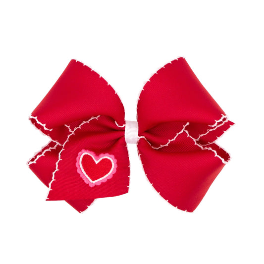 Wee Ones heart-embroidered moonstitch bow with WeeStay Clip provides secure all-day wear in red and white.