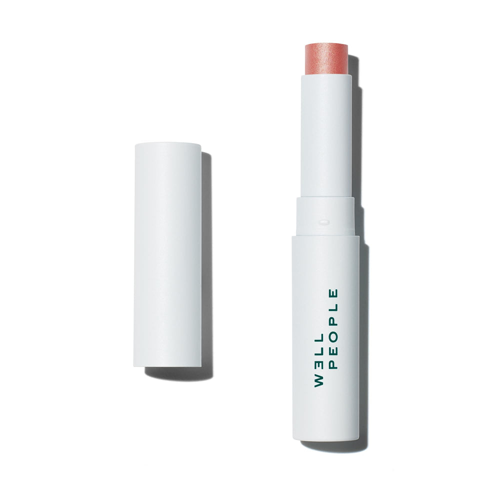 Well People Lip Butter SPF 15 tinted balm on lips offering sun protection and color