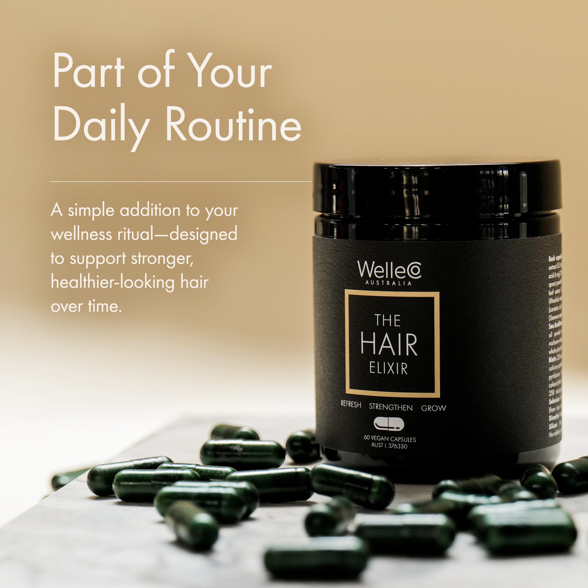 WelleCo The Hair Elixir bottle with a glass of water shown