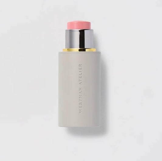 Westman Atelier Baby Cheeks Blush Stick Coquette swatch shows buildable pinky-peach glow.