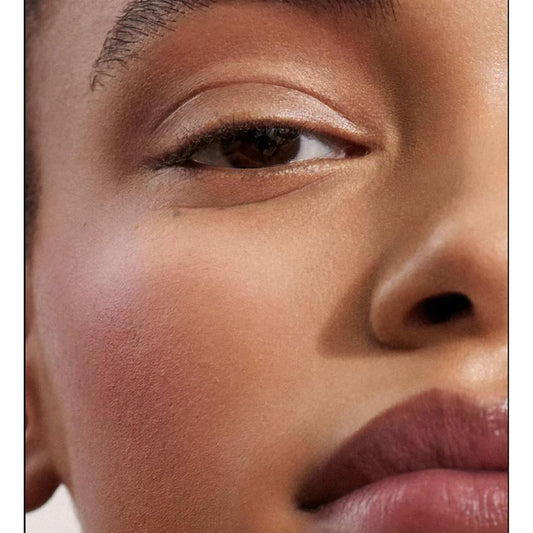 WESTMAN ATELIER Baby Cheeks Blush Stick Poppet swatch on cheek for natural flush.