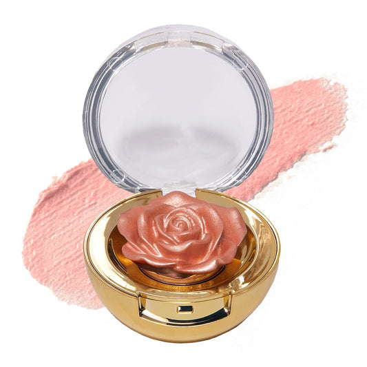 Winky Lux Cheeky Rose cream highlighter swatch adds a radiant candlelit glow.