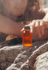 Wonder Valley Face Oil application moment shows gentle massaging motion.