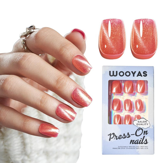 Wooyas cat-eye nails in watermelon pink with a glossy finish for chic salon-worthy shine.