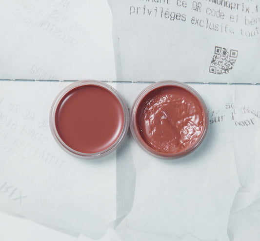 Close-up texture of XOUL lip balm shows smooth glide for daily use.