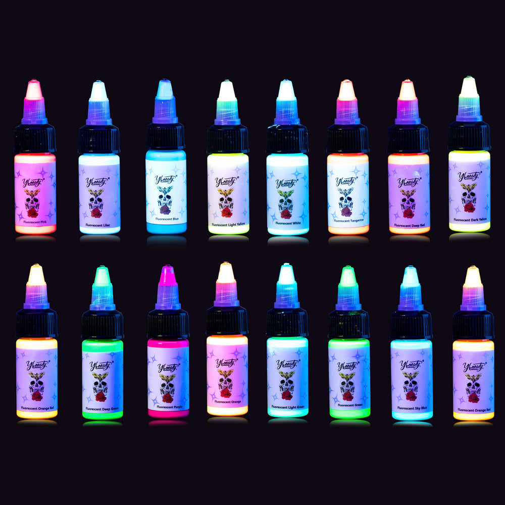 Ybeauty 16-color tattoo ink set glowing under UV light for vibrant designs.