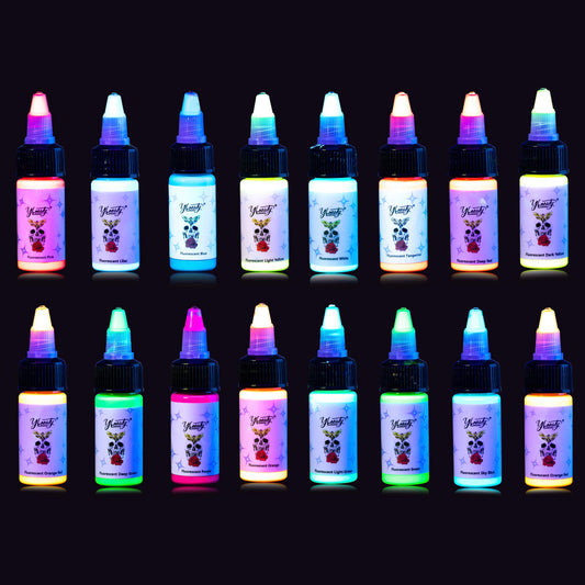 Ybeauty 16-color tattoo ink set glowing under UV light for vibrant designs.